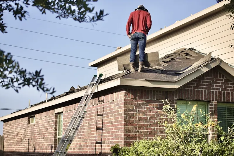 Professional roofer working on a residential roof in Nerstrand